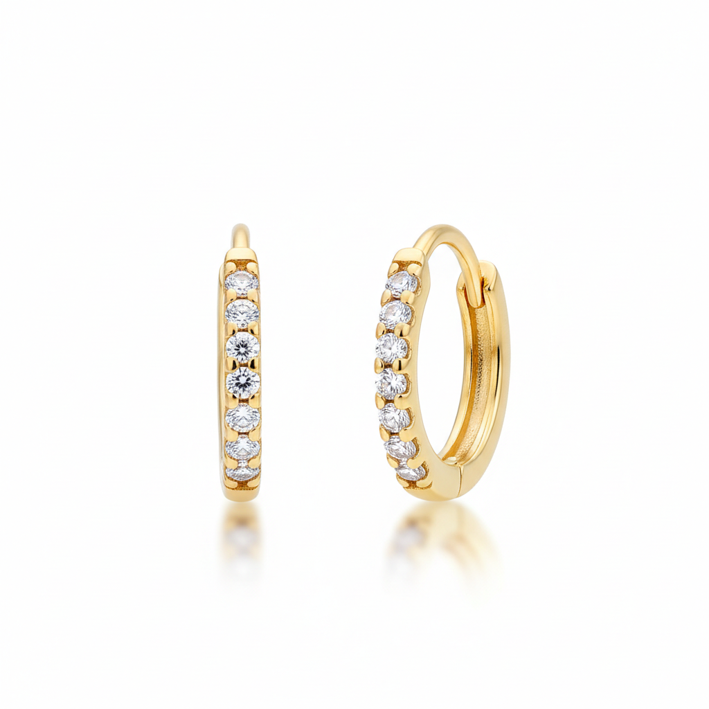 Gold hoop earrings with embedded diamonds on a white background