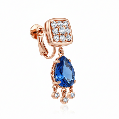 Rose gold earring with blue teardrop gem and clear stones on a white background