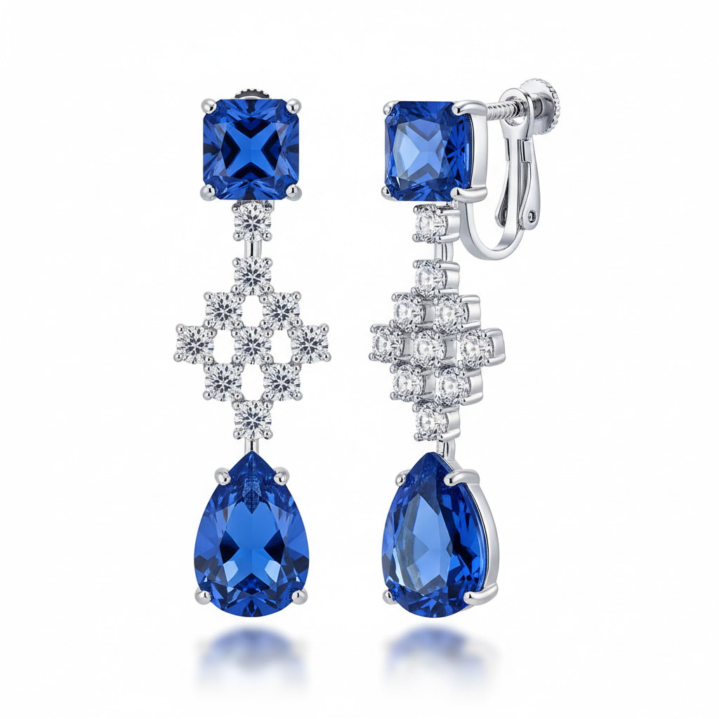 Pair of blue gemstone earrings with silver hooks on a white background