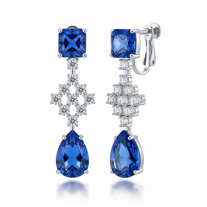 Pair of blue gemstone earrings with silver hooks on a white background